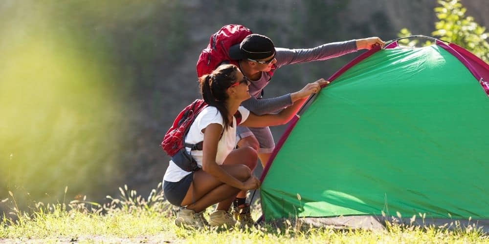 people setting up a tent